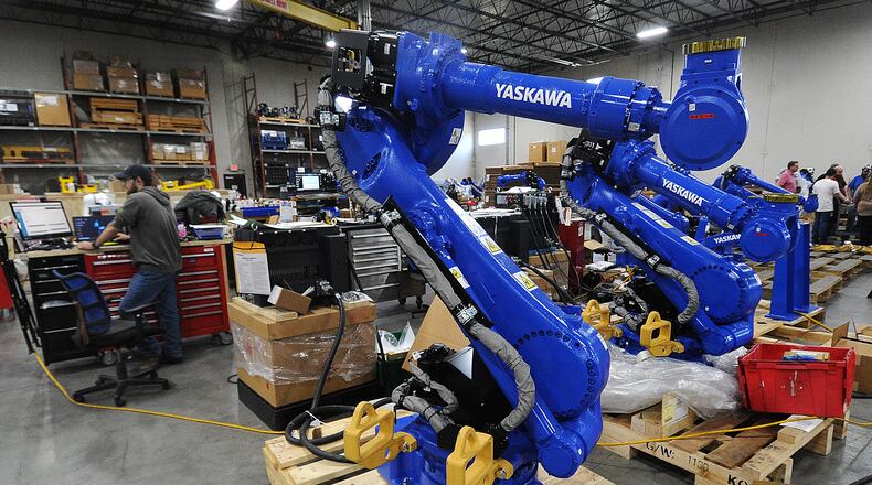 Inside the Yaskawa Motoman Miamisburg headquarters. The company is expanding its 305,000-square-foot Miamisburg headquarters by 185,000 square feet starting this month to accommodate the need for greater production at the facility, which opened in Miamisburg in 2011. MARSHALL GORBY\STAFF