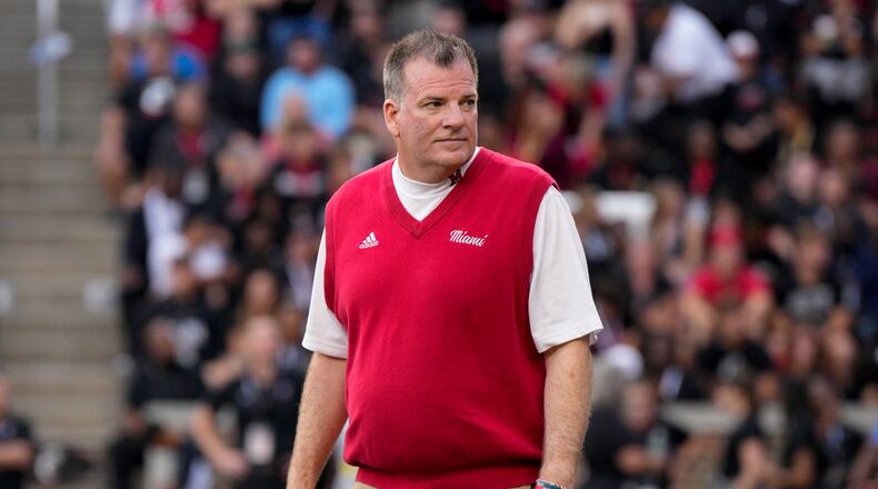 Miami (Ohio) head coach Chuck Martin walks on the field prior to an NCAA college football game against Cincinnati, Saturday, Sept. 16, 2023, in Cincinnati. (AP Photo/Jeff Dean)