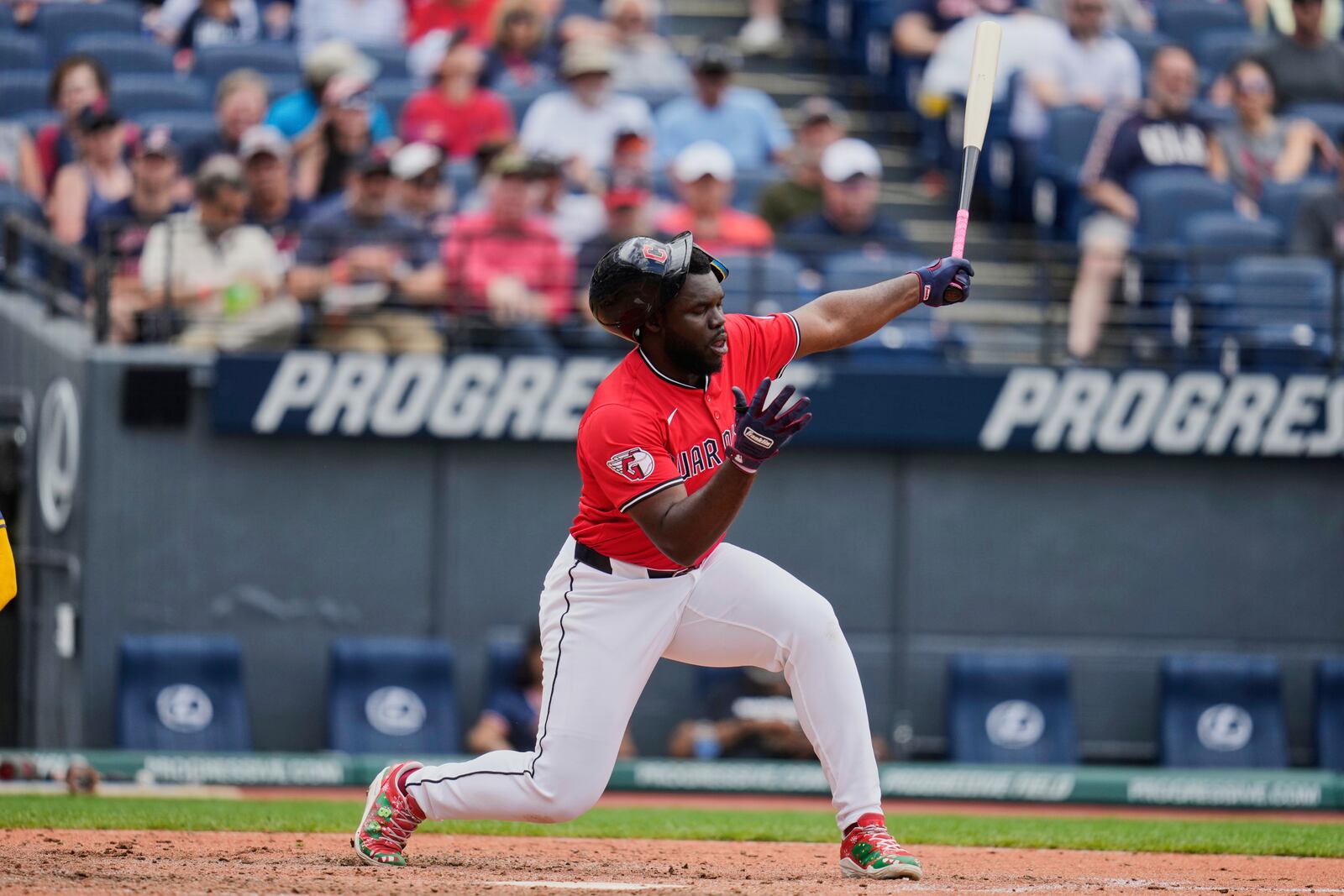 Cleveland Guardians' Jhonkensy Noel loses his helmet as he strikes out in the seventh inning of a baseball game against the Milwaukee Brewers in Cleveland, Wednesday, May 14, 2025. (AP Photo/Sue Ogrocki)