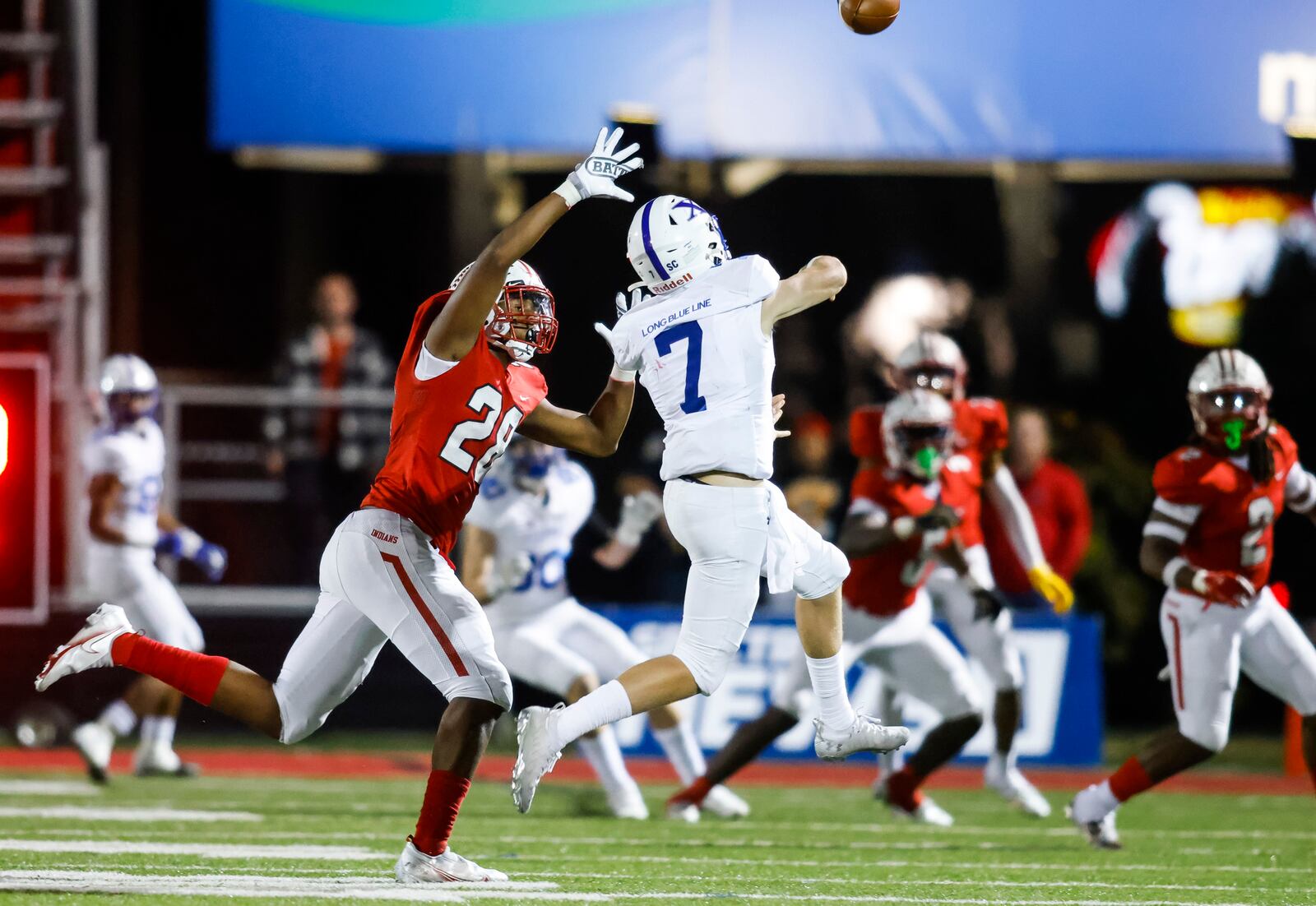 Fairfield's AAmir Rogers (28) pressures St. Xavier quarterback Chase Herbstreit during their Division I Region 4 playoff football game Friday, Oct. 28, 2022 at Fairfield Stadium. St. Xavier won 42-28. NICK GRAHAM/STAFF
