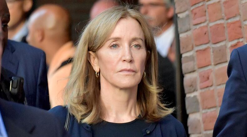 Felicity Huffman exits John Moakley U.S. Courthouse where Huffman received a 14 day sentence for her role in the college admissions scandal on September 13, 2019 in Boston, Massachusetts.