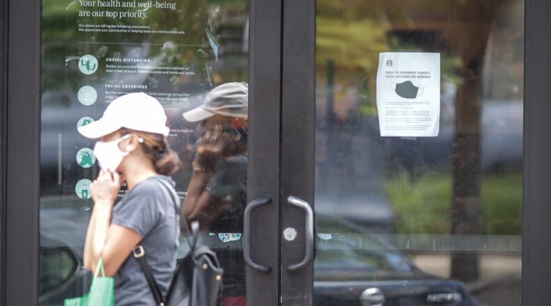 Many large retailers are now requiring that customers join their employees in wearing face masks to stop the spread of the coronavirus. Starbucks, Best Buy and Kroger have also announced mandatory masks nationwide in recent days. Starbucks and Best Buy started requiring that customers wear masks on July 15. Most people who entered the Starbucks on Far Hills Ave. in Oakwood were wearing masks. JIM NOELKER/STAFF