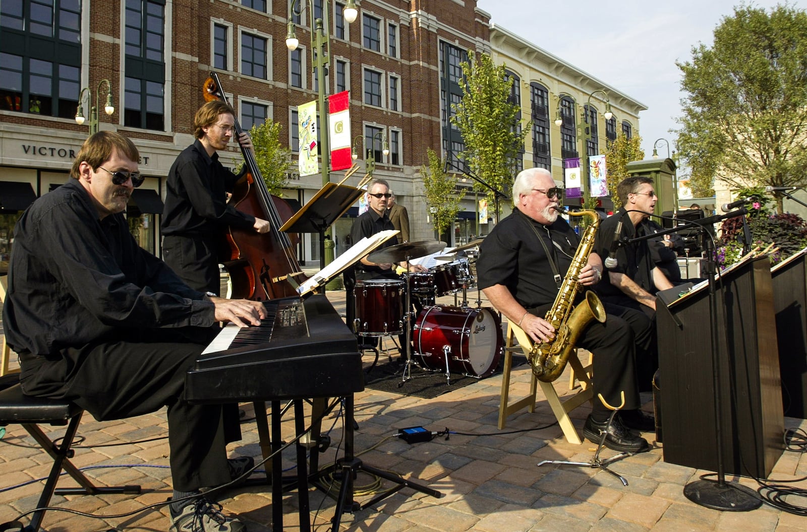The Dayton Jazz Orchestra Combo provides entertainment at Thursday's grand opening of 
The Greene in Beavercreek. Staff photo by Chris Stewart