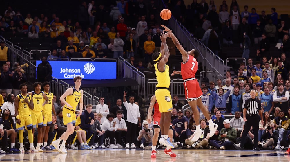 Dayton's Keonte Jones blocks a shot in overtime against Marquette on Wednesday, Nov. 19, 2025, at Fiserv Arena in Milwaukee, Wis. David Jablonski/Staff