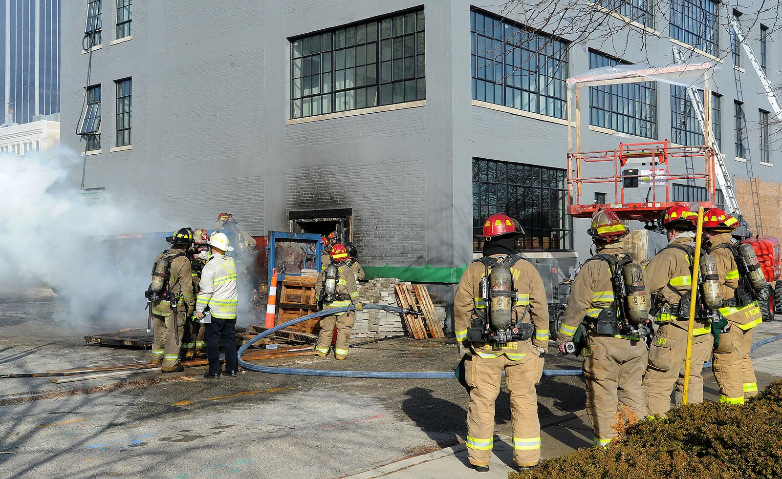Dayton Firefighters responded to a two-alarm fire near Ludlow Street and Fifth Street in downtown Dayton Friday afternoon. Officials said that no one was injured in the blaze and the building, which is being renovated, also was not damaged. Officials believe discarded smoking material in a dumpster started the fire.  MARSHALL GORBY\STAFF