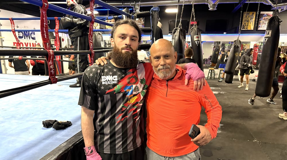 Unbeaten middleweight Jrue Louis King and Daniel Meza-Cuadra, his trainer, his friend and the owner of the DMC Boxing Academy in Centerville. TOM ARCHDEACON