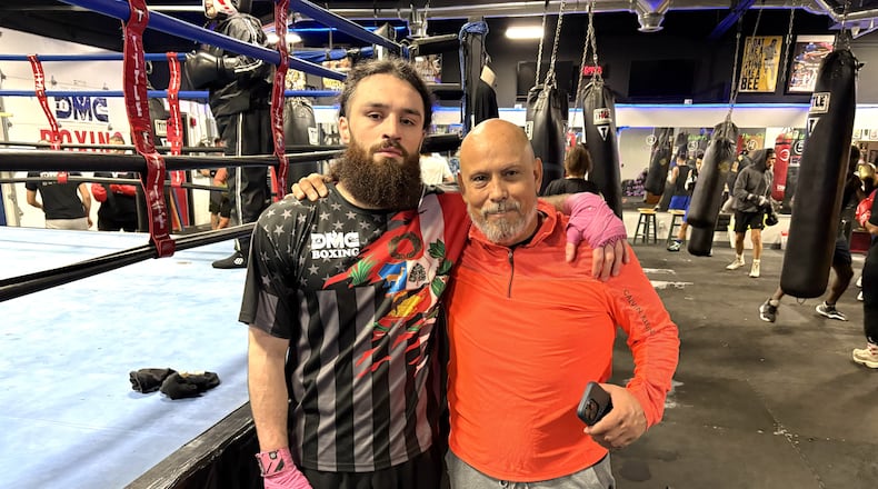 Unbeaten middleweight Jrue Louis King and Daniel Meza-Cuadra, his trainer, his friend and the owner of the DMC Boxing Academy in Centerville. TOM ARCHDEACON