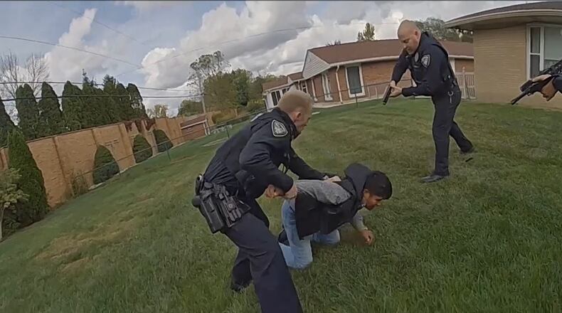 A Kettering police officer shot and wounded a man suspected of multiple crimes on Oct. 8, 2023 after a chase that started in the Kettering Meijer parking lot and ended in a neighborhood yard.