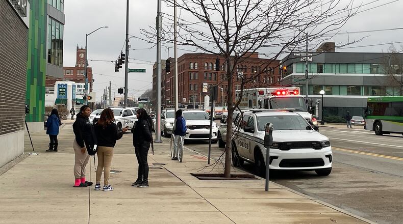 Dayton emergency crews were outside the main branch of the Dayton Metro Library after a reported fight and an evacuation of the building. SYDNEY DAWES, STAFF