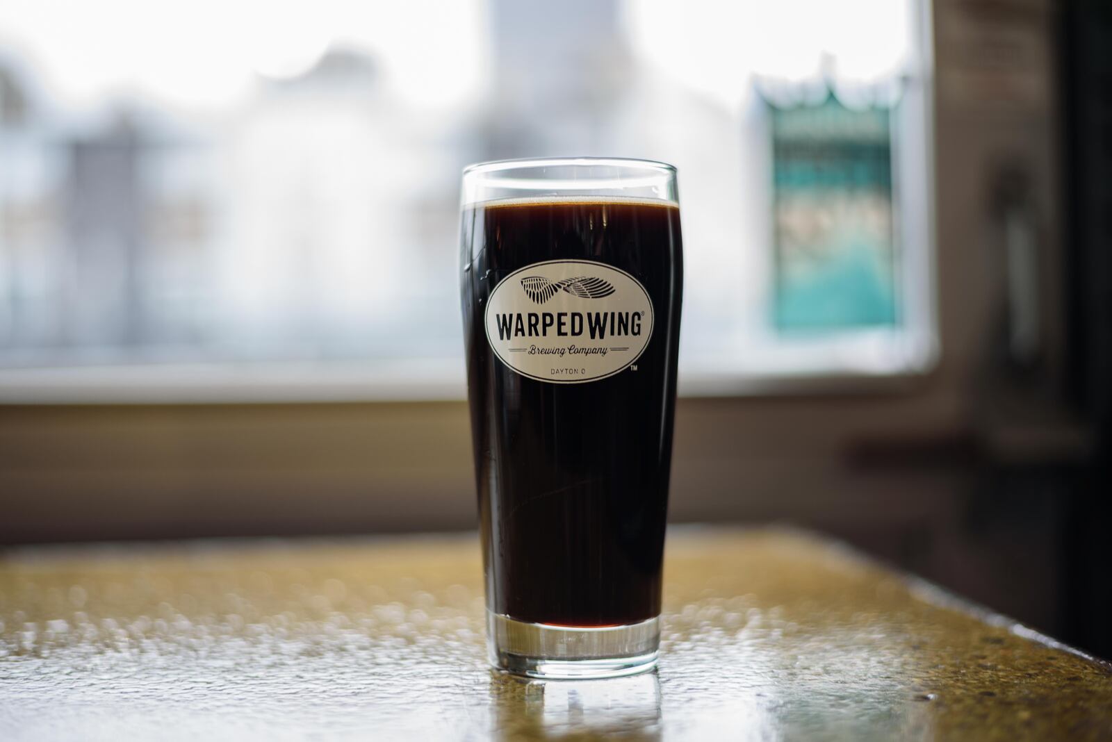 Warped Wing Brewing Company tapped the 10 TON Irish Cream Stout, a special variation of their Oatmeal Stout ahead of St. Patrick's Day at their brewery in downtown Dayton on Saturday, March 9. TOM GILLIAM / CONTRIBUTING PHOTOGRAPHER