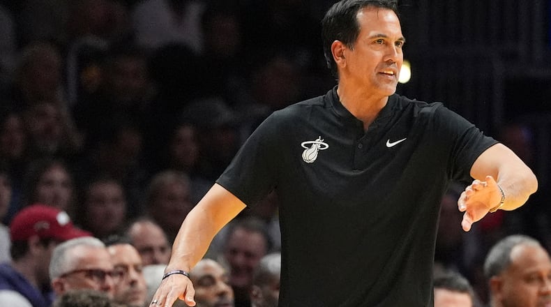 Miami Heat head coach Erik Spoelstra directs his players during the second half of an Emirates NBA Cup basketball game against the Milwaukee Bucks, Wednesday, Nov. 26, 2025, in Miami. (AP Photo/Rebecca Blackwell)