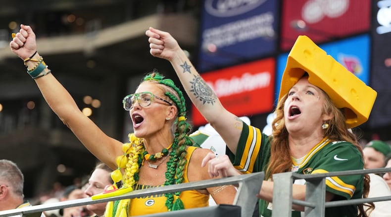 FILE - Green Bay Packers fans cheer during the first half of an NFL football game against the Arizona Cardinals Sunday, Oct. 19, 2025, in Glendale, Ariz. (AP Photo/Rick Scuteri, File)