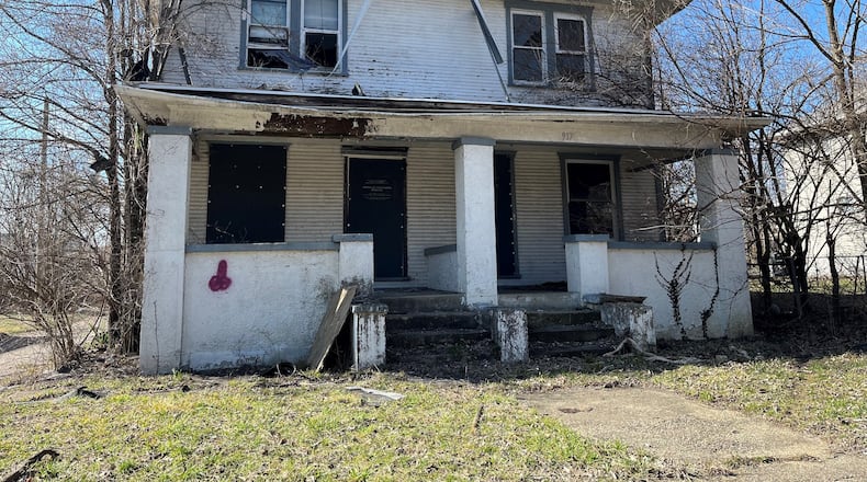 This property on the 900 block of North Euclid Avenue in Dayton owes more than $72,000 in delinquent taxes. CORNELIUS FROLIK / STAFF