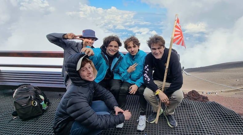 Andrew Locke, far right, joins other college students on an international trip. CONTRIBUTED