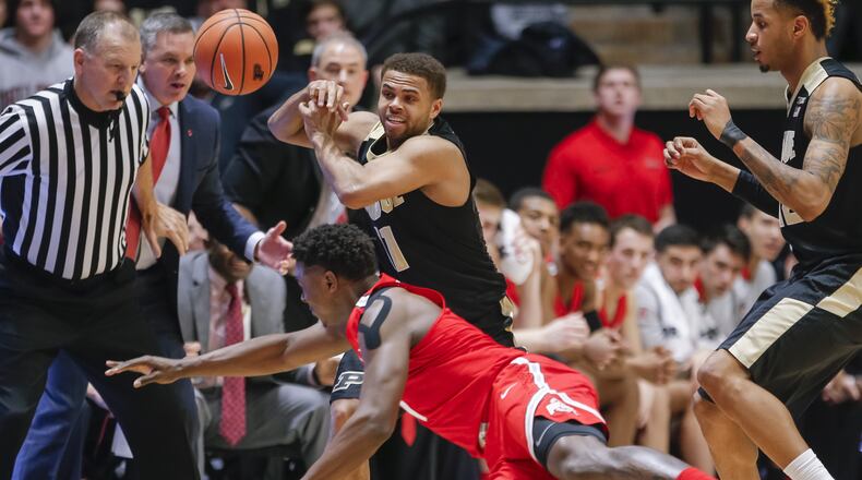 WEST LAFAYETTE, IN - FEBRUARY 07: P.J. Thompson #11 of the Purdue Boilermakers loses the ball as Jae’Sean Tate #1 of the Ohio State Buckeyes dives during the game at Mackey Arena on February 7, 2018 in West Lafayette, Indiana. (Photo by Michael Hickey/Getty Images)