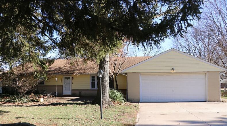 The brick ranch has a renovated kitchen with quartz countertops and off-white cabinetry. The property has a 2-car garage with extra parking pad, and a white-vinyl fence surrounds the back yard. CONTRIBUTED PHOTOS BY KATHY TYLER