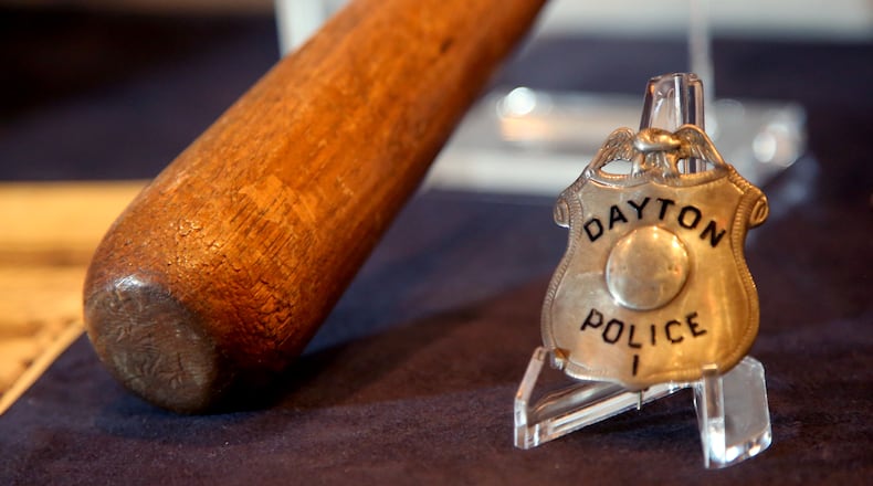 Dayton Police Badge Number 1, worn by Patrolman William Funk, is on display in Bootleggers, Bandits, and Badges: From Dry Times to Hard Times in Dayton, Ohio,  LISA POWELL / STAFF