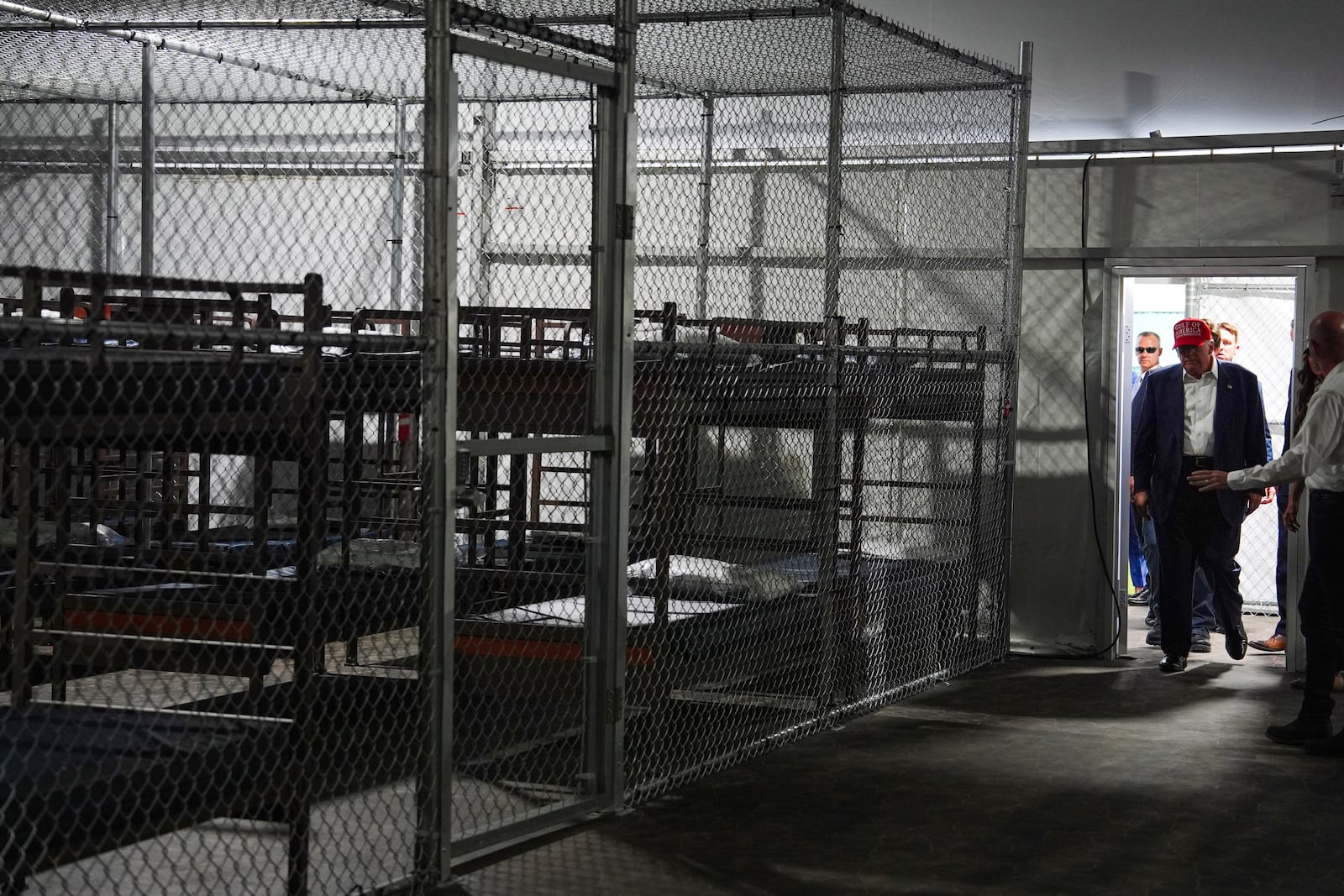 President Donald Trump tours "Alligator Alcatraz," a new migrant detention facility at Dade-Collier Training and Transition facility, Tuesday, July 1, 2025, in Ochopee, Fla. (AP Photo/Evan Vucci)