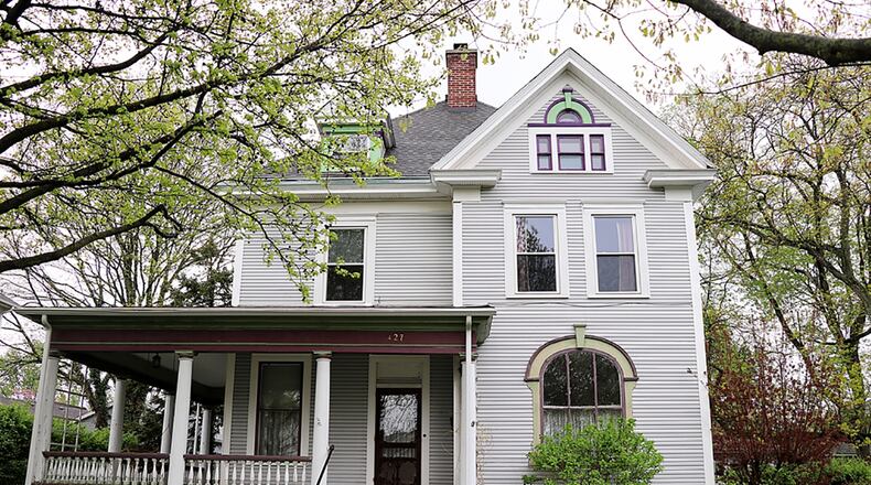 Located in the Southwest Historic District of Troy, the 4-bedroom house has a wrap-around front porch, a screen-enclosed porch with ceiling paddle fan and a multi-level wooden deck. The Victorian-style home has about 2,200 sq. ft. of living space and has a private garden back yard and a 4-car carriage house with a useable second floor. CONTRIBUTED PHOTO BY KATHY TYLER