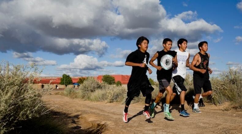 Hopi High School cross-country runners, from left, Ryan Honyumptewa, a sophomore; Andre Lucus, a junior; and Diome Talaswaima and Latrell Lee, who are sophomores, practice at the school in Keams Canyon, Ariz., Oct. 22, 2015. Running has a special place in Hopi culture, and the Hopi High School boys’ cross-country team is building on that heritage, with a chance at a 26th straight Arizona state title. (Nick Cote/The New York Times)