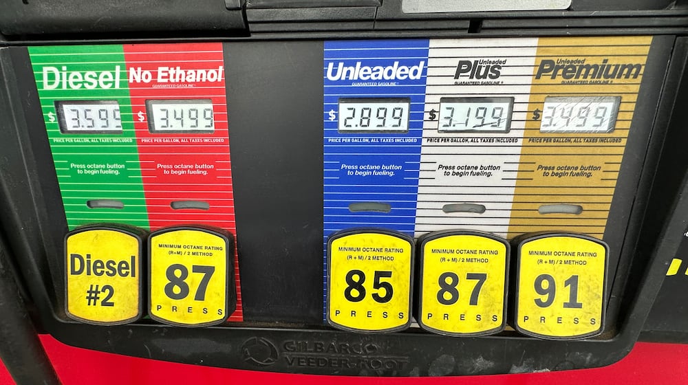 Gas prices are displayed over various grades available at a pump at a QuikTrip gas station, Tuesday, March 3, 2026, in Greenwood Village, Colo. (AP Photo/David Zalubowski)