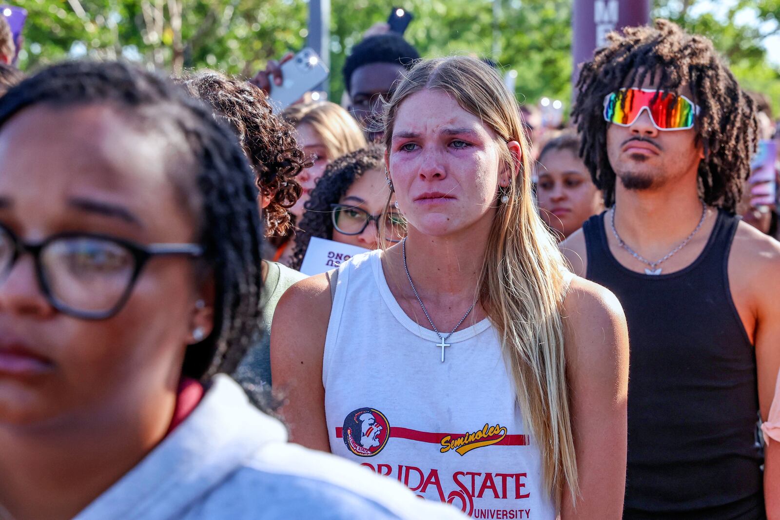 A student mourns during a vigil on the Florida State campus at Langford Green, Tallahassee, Fla., Friday, April 18, 2025. (AP Photo/Gary McCullough)