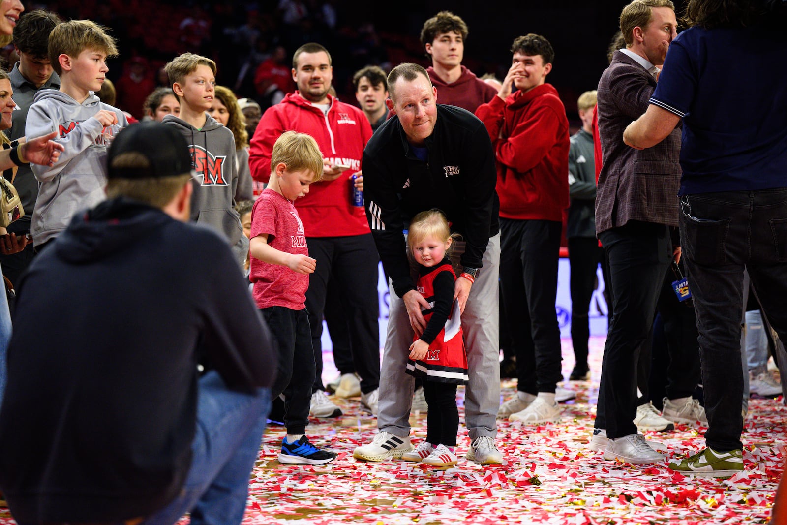 Miami University coach Travis Steele embraces his daughter after the RedHawks beat Toledo 74-72 in Mid-American Conference action on Tuesday, March 3, 2026 at Millett Hall. Miami clinched its first MAC regular season crown since 2005-06. JEREMY MILLER / CONTRIBUTED PHOTO