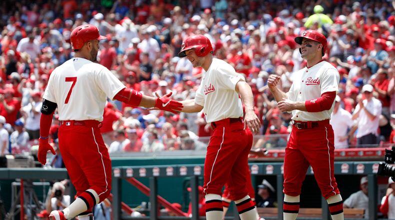 CINCINNATI, OH - JUNE 30: Eugenio Suarez #7 of the Cincinnati Reds is congratulated by Nick Senzel #15 after hitting a three-run home run in the first inning against the Chicago Cubs at Great American Ball Park on June 30, 2019 in Cincinnati, Ohio. (Photo by Joe Robbins/Getty Images)