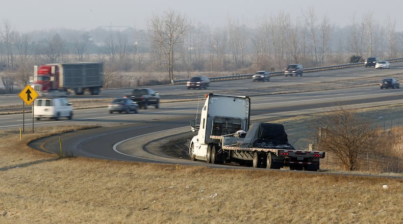 A truck is parked on the ramp from State Route 734 to I-75 southbound in Fayette County at 7:30 a.m. The increase in truck traffic, mandatory rest periods for drivers and the lack of adequate space for truck parking has left many drivers no alternative other than the side of the ramps for rest breaks. TY GREENLEES / STAFF
