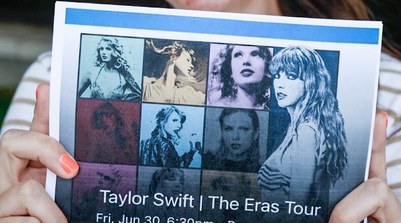 Kenzie McEvily of Oakwood shows her Taylor Swift ticket she purchased in November of last year. McEvily is going to the concert in Cincinnati with four friends who can't wait to hear the surprise song, friendship bracelets and outfits. JIM NOELKER/STAFF