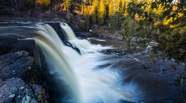 A stretch of the Gitchi-Gami State Trail takes cyclists between Gooseberry Falls State Park, above, and Split Rock Lighthouse. (Brian Peterson/Minneapolis Star Tribune/TNS)