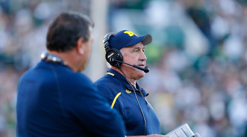 EAST LANSING, MI - OCTOBER 25:  Michigan Wolverines defensive coordinator Greg Mattison watches the action from the sidelines during the second quarter of the game against the Michigan State Spartans at Spartan Stadium on October 25, 2014 in East Lansing, Michigan. The Spartans defeated the Wolverines 35-11.  (Photo by Leon Halip/Getty Images)