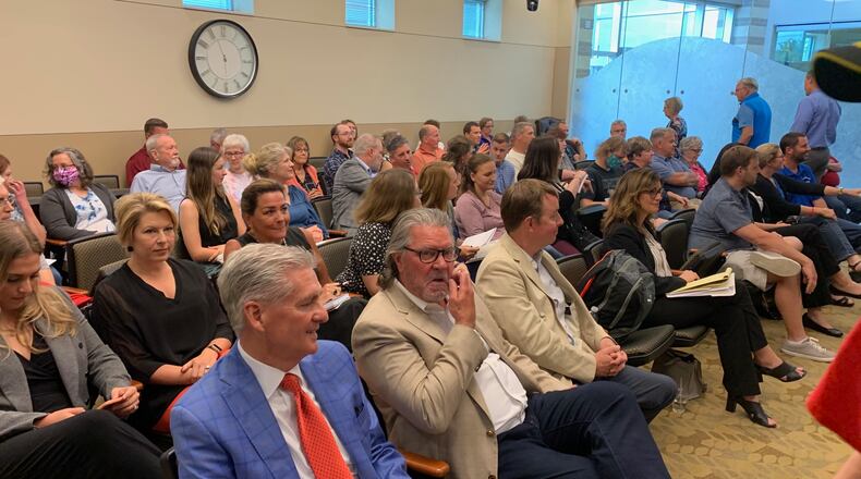 Springboro City Council chambers was full Wednesday night as the Springboro Planning Commission held its first in-person meeting in more than a year. The Planning Commission unanimously approved the rezoning and preliminary development plan for the $256 million Easton Farm multi-use project. Developers Larry Dillin, left, and Doug Borror were at the meeting to present the latest plan to the Planning Commission. ED RICHTER/STAFF