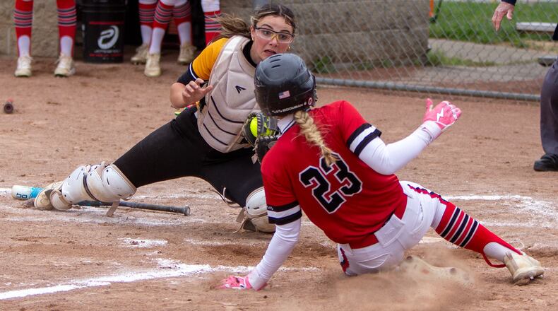 Centerville catcher Riley Bakan tags out Lakota West's Jenna Dilley on a throw from centerfielder Olivia Castle during the Elks' 8-1 victory Thursday in the Division I district final at Kings High School. Dilley was trying to score from second with two outs in the third inning on a single by Lizzy Meyer. JEFF GILBERT / CONTRIBUTED