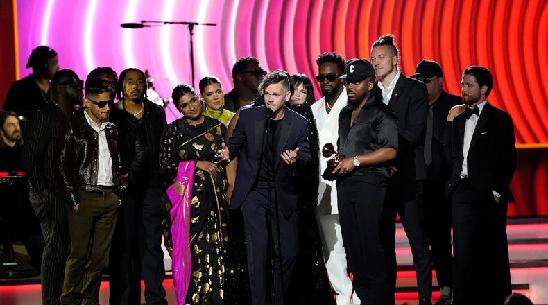 Elevation Worship and Maverick City Music accept the award for best contemporary christian music album for "Old Church Basement" at the 64th Annual Grammy Awards on Sunday, April 3, 2022, in Las Vegas. Elevation Worship will appear Aug. 12 at the Nutter Center. (AP Photo/Chris Pizzello)
