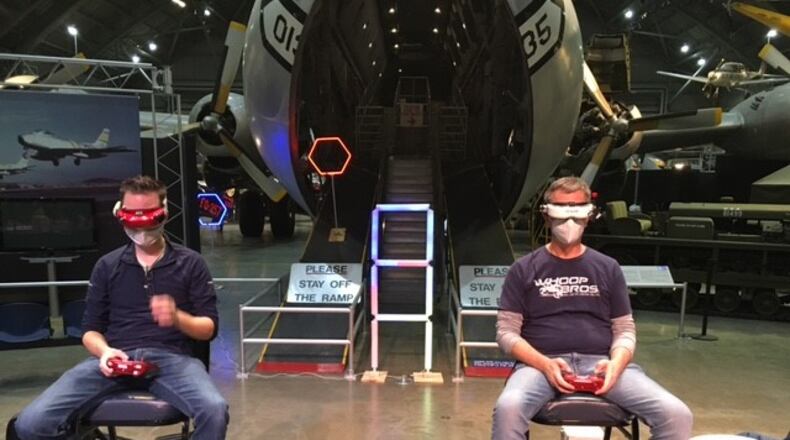 Pilots of micro-drones warm up for Saturday's drone racing event at the National Museum of the U.S. Air Force. THOMAS GNAU/STAFF