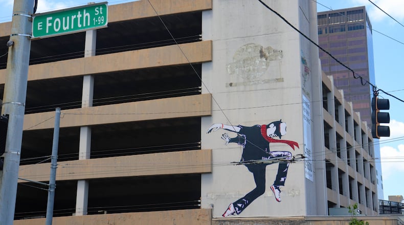 One of the murals painted for the Downtown Dayton Partnership's Urban Art Intersections project. This one can be found on the face of a parking garage on the corner of Jefferson and Fourth Street. DION JOHNSON/STAFF