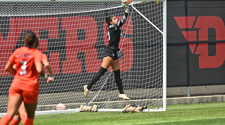 UD goalkeeper Batoul Reda makes a leaping save of a free kick by Illinois Sunday at Baujan Field. Reda had six saves and her first shutout of the season in a 0-0 tie. Erik Schelkun/CONTRIBUTED