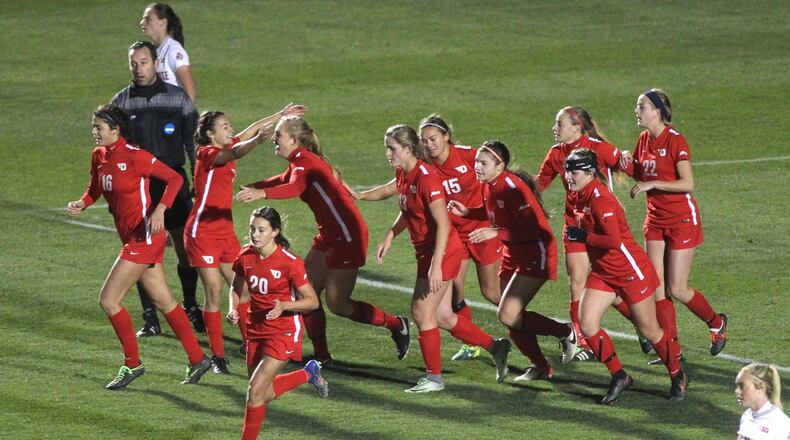 Dayton celebrates after taking a 2-1 lead on a goal by Libby Leedom in the second half against Ohio State in the first round of the NCAA tournament on Saturday, Nov. 12, 2016, at Jesse Owens Memorial Stadium in Columbus. David Jablonski/Staff
