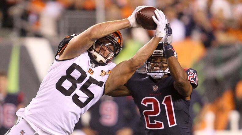 CINCINNATI, OH - SEPTEMBER 14: Tyler Eifert #85 of the Cincinnati Bengals makes a catch defended by Marcus Gilchrist #21 of the Houston Texans during the second half at Paul Brown Stadium on September 14, 2017 in Cincinnati, Ohio. (Photo by John Grieshop/Getty Images)