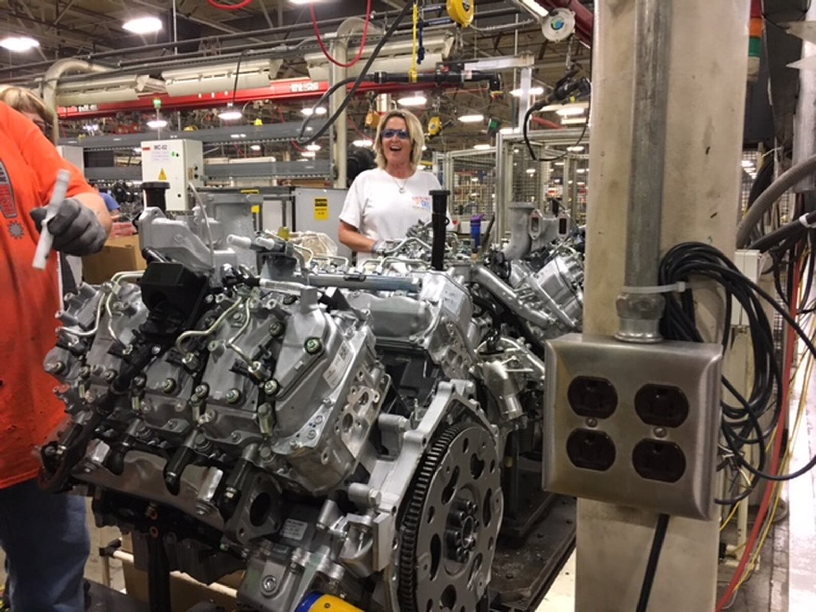 Maggie Floyd is part of a team of assembly workers at the DMAX truck engine plant in Moraine, in a photo taken last year. THOMAS GNAU/STAFF