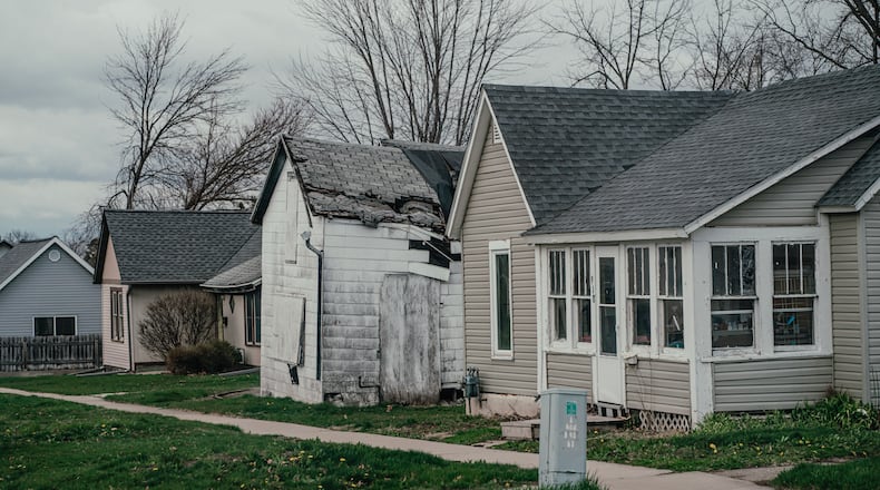 Storm-damaged homes in Marshalltown, Iowa, which was devastated by a tornado in 2018 and a derecho two years later, on April 11, 2024. As climate change produces more extreme weather, insurers are losing money, even in states with low hurricane and wildfire danger. (Jamie Kelter Davis/The New York Times)