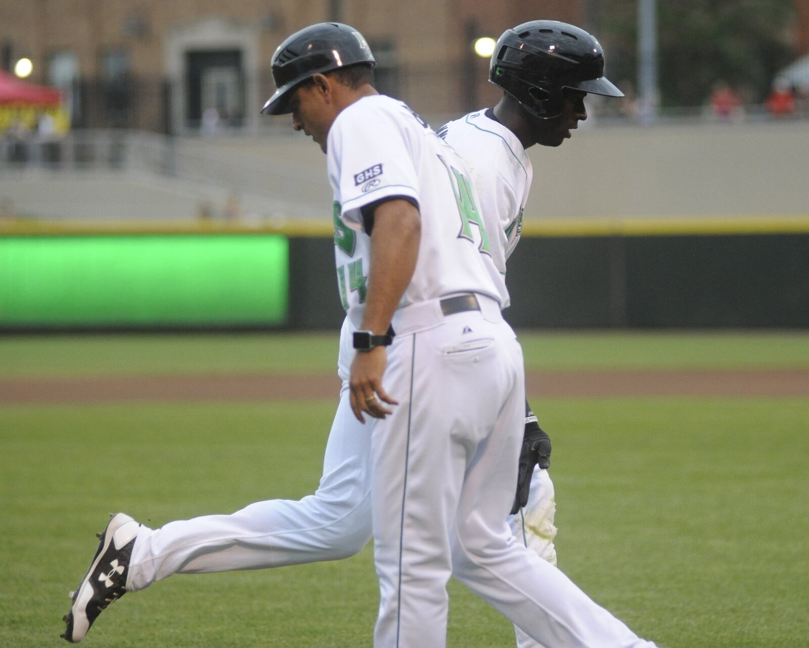 Dragons manager Luis Bolivar congratulates Taylor Trammell after a home run. The Dragons lost 8-3 to the visiting Great Lakes Loons (Dodgers) at Dayton’s Fifth Third Field on Thursday, June 15, 2017. MARC PENDLETON / STAFF