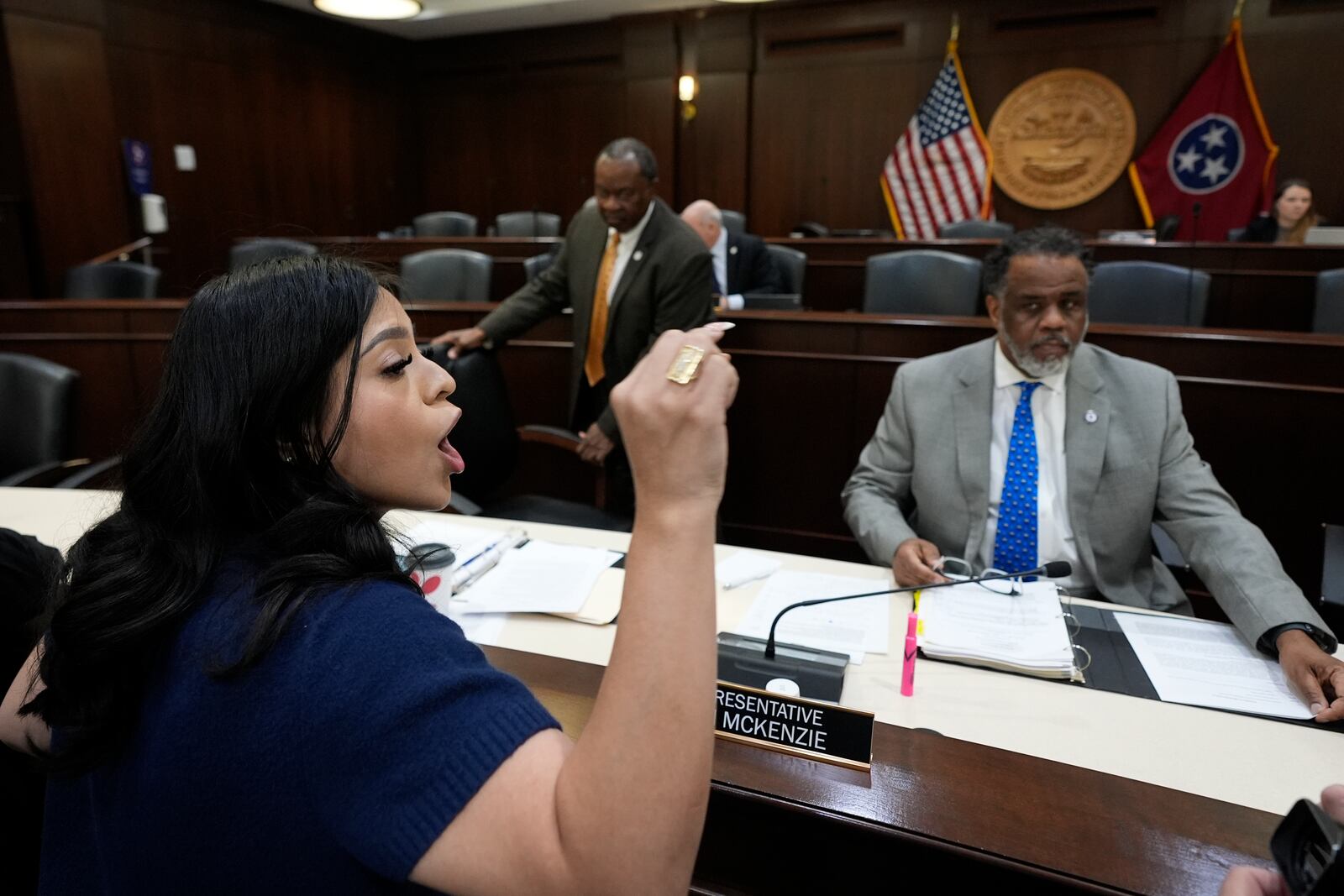 FILE - Gisselle Huerta, left, yells against a bill that would allow public and charter schools to deny immigrant students from enrolling during a House meeting of the Education K-12 subcommittee, in Nashville, Tenn., March 11, 2025. (AP Photo/George Walker IV, File)