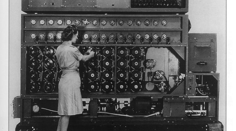 A U.S. Navy WAVE demonstrates the Desch Bombe, one of 120 codebreaking machines designed and built in NCR's Building 26, between 1943-45, for use in cracking the Nazi U-boat and other Enigma codes. Dayton History photo