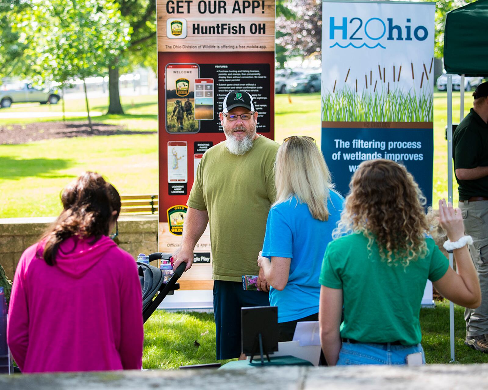 David Guinaugh visits with Beth Edsall, Beaver Creek Wetlands Association outreach director at the association’s booth in the annual Wright-Patterson Air Force Base Pollinator Expo on June 8. The expo sought to educate people about the important role pollinators play in nature and agriculture. U.S. AIR FORCE PHOTO/R.J. ORIEZ