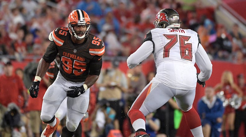 Tampa Bay Buccaneers offensive tackle Donovan Smith (76) blocks against Cleveland Browns defensive end Myles Garrett (95) during the first half of an NFL preseason football game Saturday, Aug. 26, 2017, in Tampa, Fla. (AP Photo/Phelan M. Ebenhack)