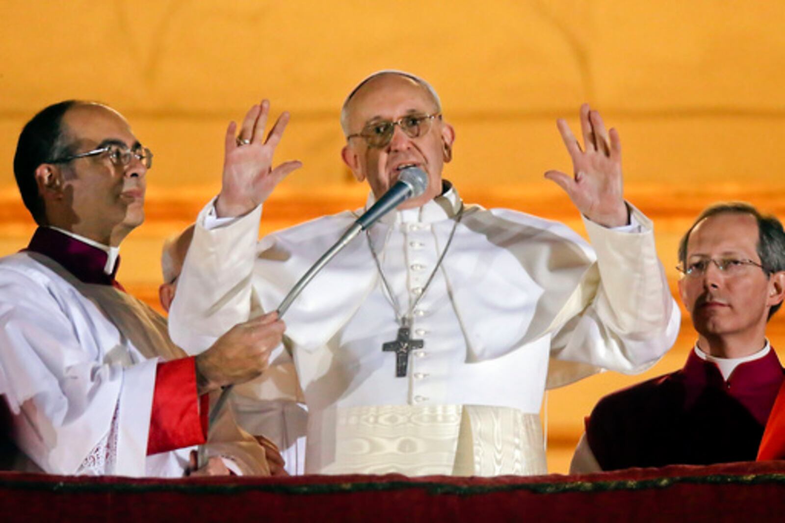 FILE - Argentine Cardinal Jorge Bergoglio, who chose the name of Pope Francis, waves to the crowd from the central balcony of St. Peter's Basilica after being elected 266th pontiff of the Roman Catholic Church, at the Vatican, Wednesday, March 13, 2013. (AP Photo/Gregorio Borgia, file)