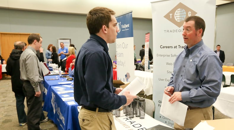 Tyler Meier of Oxford, talks with Tom Dalessandro of TradeGlobal during the Miami University Regional Butler County Job Fair, Wednesday, April 6, 2016. GREG LYNCH / STAFF