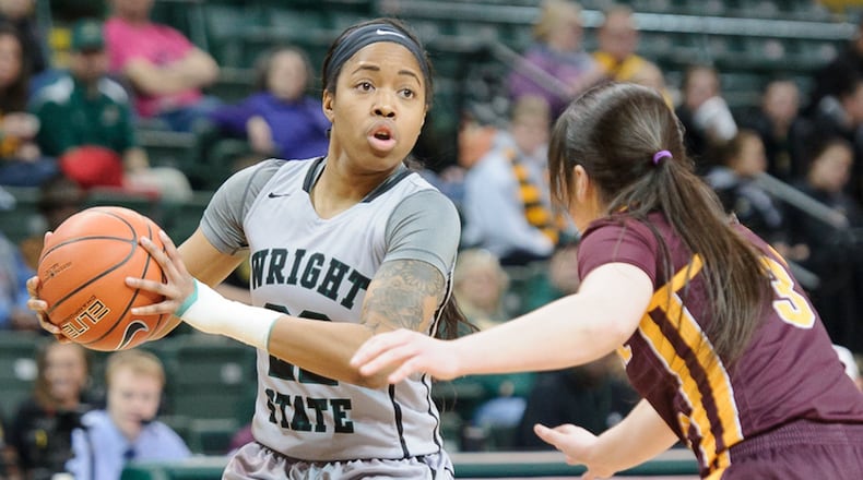 Wright State junior guard Chelsea Welch looks to pass with pressure from Central Michigan’s Presley Hudson during a WNIT game on Thursday at the Nutter Center. Welch scored 21 points for the Radiers, who play at Michigan on Saturday. Contributed Photo by Bryant Billing